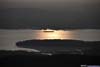 Boat in Hudson River against Setting Sun