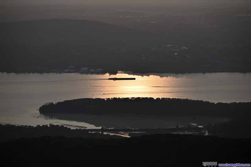 Boat in Hudson River against Setting Sun