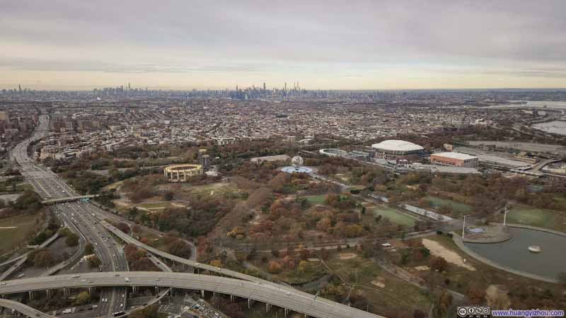 Flushing Meadows Corona Park before Distant New York City Skyline