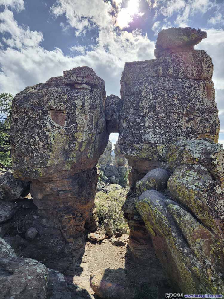 Punch and Judy behind Rock Arch