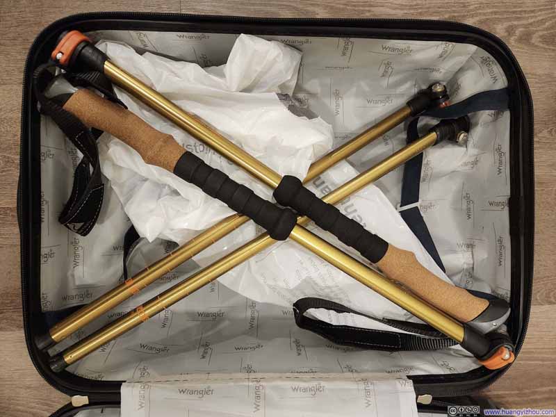 Packing Hiking Poles into Suitcase